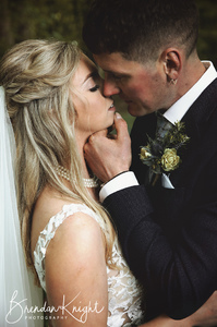 Romantic close up of bride and groom kissing