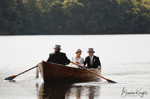 bride and groom in rowing boat