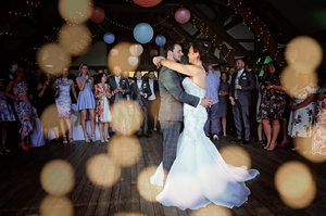 bride and groom hugging on the dance floor 